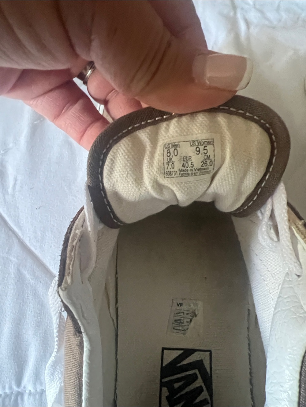 Vans White Canvas Low-Top Sneakers with Brown Trim and Black Logo
